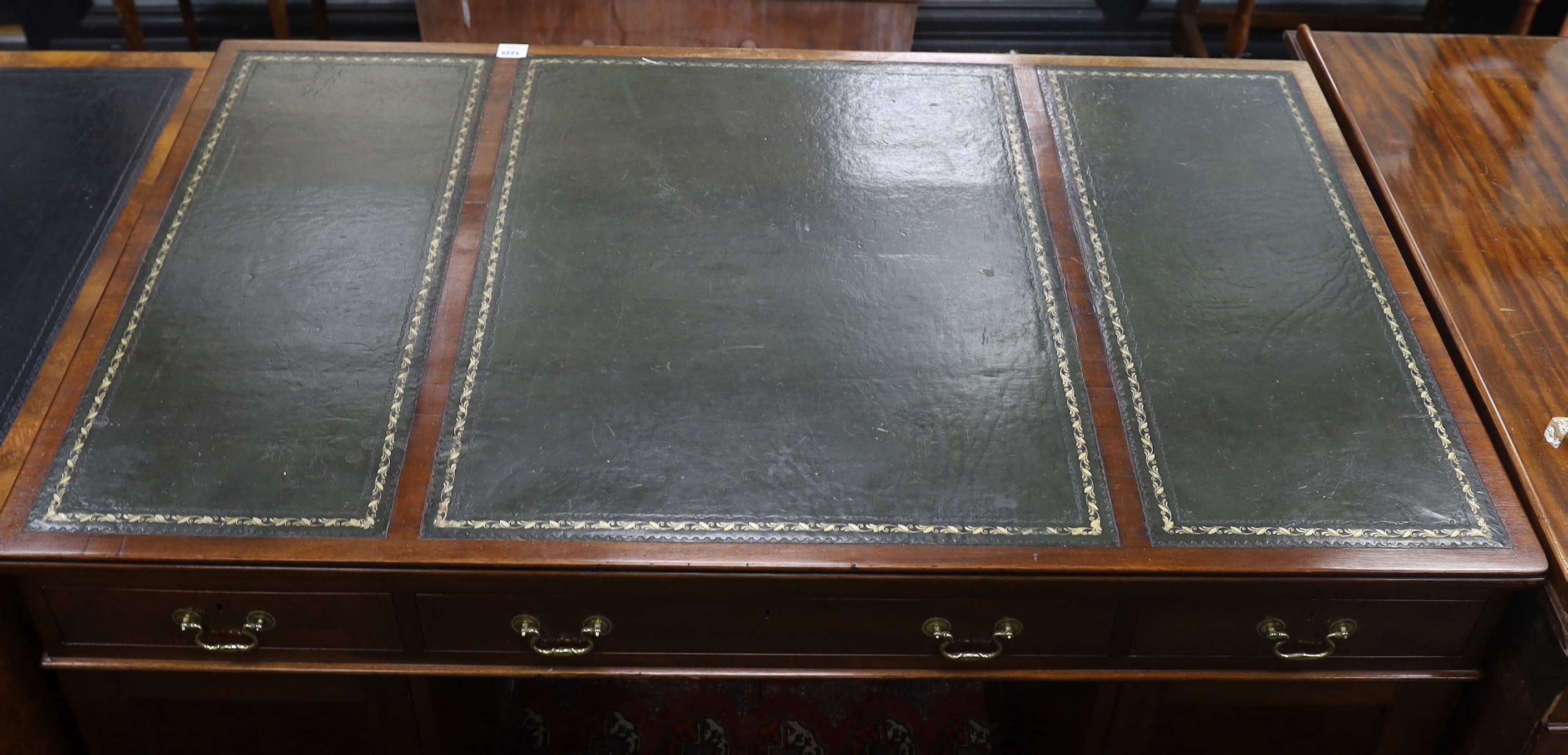 An early 20th century George III style mahogany pedestal partner's desk, width 152cm, depth 98cm, height 78cm